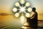 A peaceful and serene image of a person meditating by a calm lake during sunrise, surrounded by soft natural light, with glowing symbols of mantras floating gently in the air.